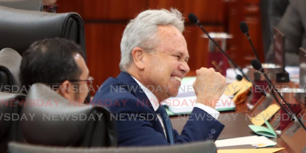 In this file photo, a happy Finance Minister Colm Imbert shakes his fist at the Opposition on in the House of Representatives. PHOTO BY ROGER JACOB - 