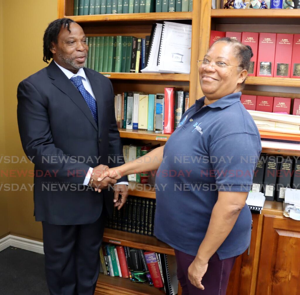 THANKS KEITH: Commissioner of State Lands Paula Drakes with her attorney Keith Scotland at his Port of Spain office  on Thursday. PHOTO BY ROGER JACOB - 