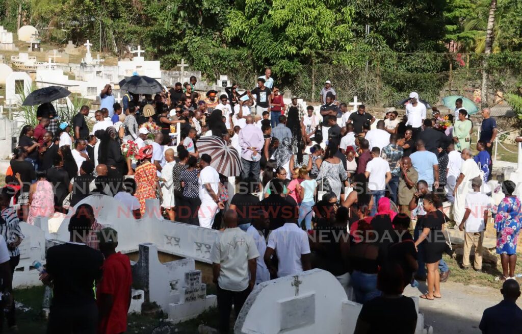 The large crowd at the church's cemetery where both murdered men were buried. PHOTO BY ROGER JACOB - 