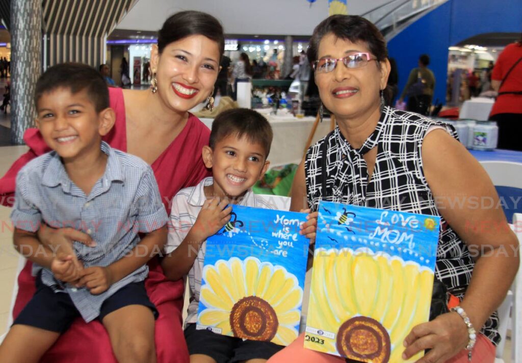 Veena Seecharan, back left, her mother Sheryl Ramdhany and children Naedon and Naryk  at the  Mummy and Me Sip and Paint at Gulf City Mall, La Romaine. - AYANNA KINSALE