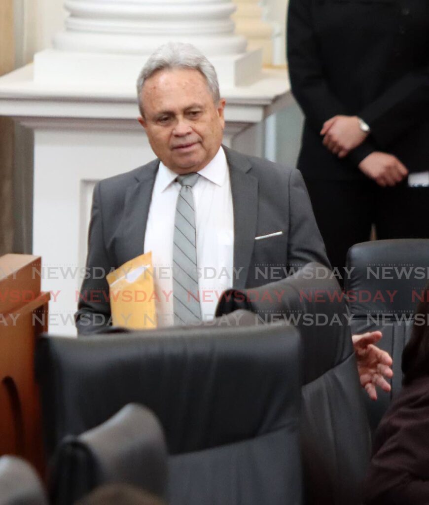 MAN IN CHARGE: Acting Prime Minister and Finance Minister Colm Imbert makes his way to his seat during the sitting of the Upper House on Tuesday. PHOTO BY ROGER JACOB - 