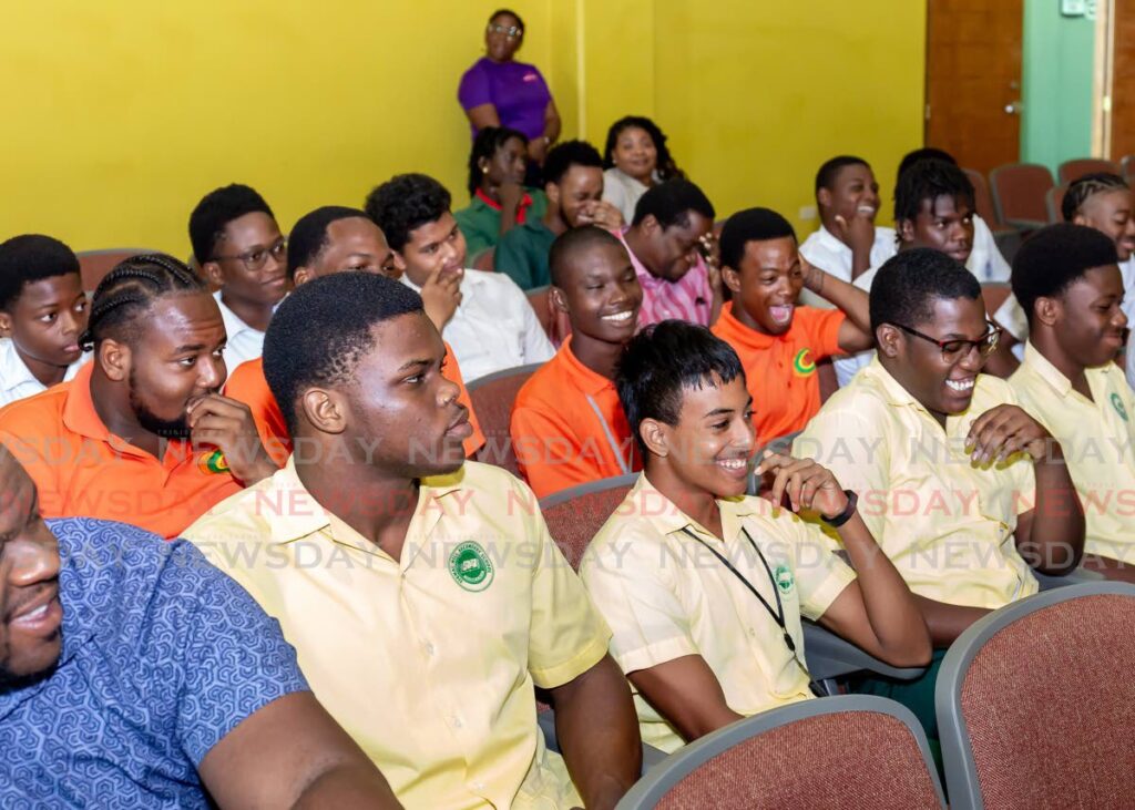 Secondary schoolboys enjoy a session at the Women of Substance seminar for the International Day of the Boy Child at Shaw Park Cultural Complex on Tuesday. - David Reid