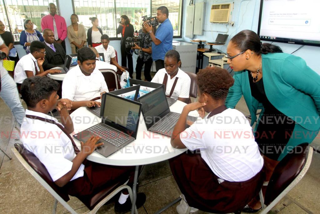 Teacher Lynelle Bahadur demonstrates the use of a laptop to learn Spanish following a laptop distribution ceremony by the Ministry of Education at Ste Madeleine Secondary school in 2018. - File Photo/ Lincoln Holder