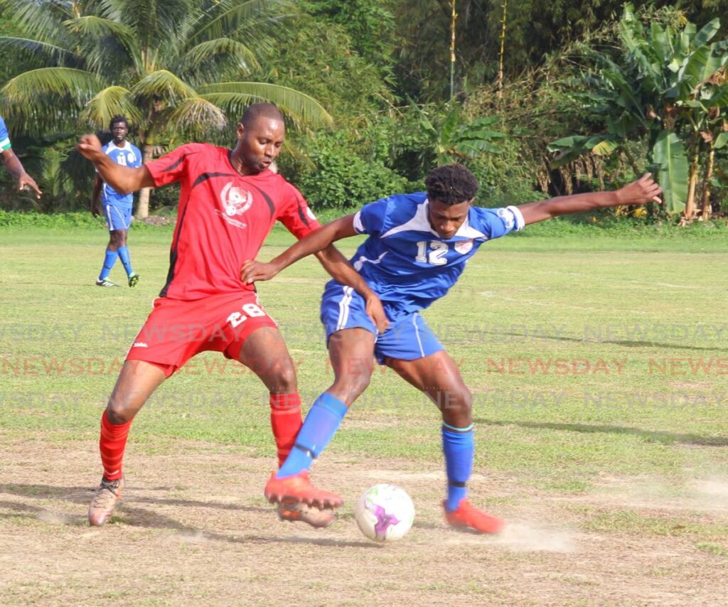 Irvin Reyes of Matura Reunited, left, tackles a Bethel United player in a 2019 contest. Both teams will be in tier two of the TT Premier Football League.  - 