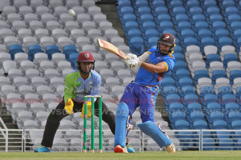 Queen's Park Cricket Club batsman Amir Jangoo on the attack against Clarke Road in the TTCB Festival opener at the Brian Lara Stadium, Tarouba on Friday. - Marvin Hamilton