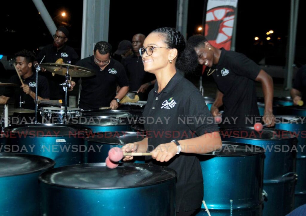 PLAYING ONE FOR PATRICK: Members of Proman Starlift Steel Orchestra play a song in tribute to former Pan Trinbago president Patrick Arnold at the Grand Stand, Queen's Park Savannah, Port of Spain on Thursday evening. PHOTO BY AYANNA KINSALE - AYANNA KINSALE