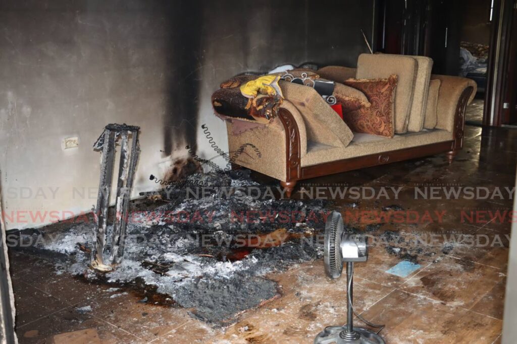 FREEPORT CRIME SCENE: Ashes and bloodstains in a room in a house in Freeport where Garib Goring's body was found partially burnt and with what appeared to be stab wounds on Sunday.  - 