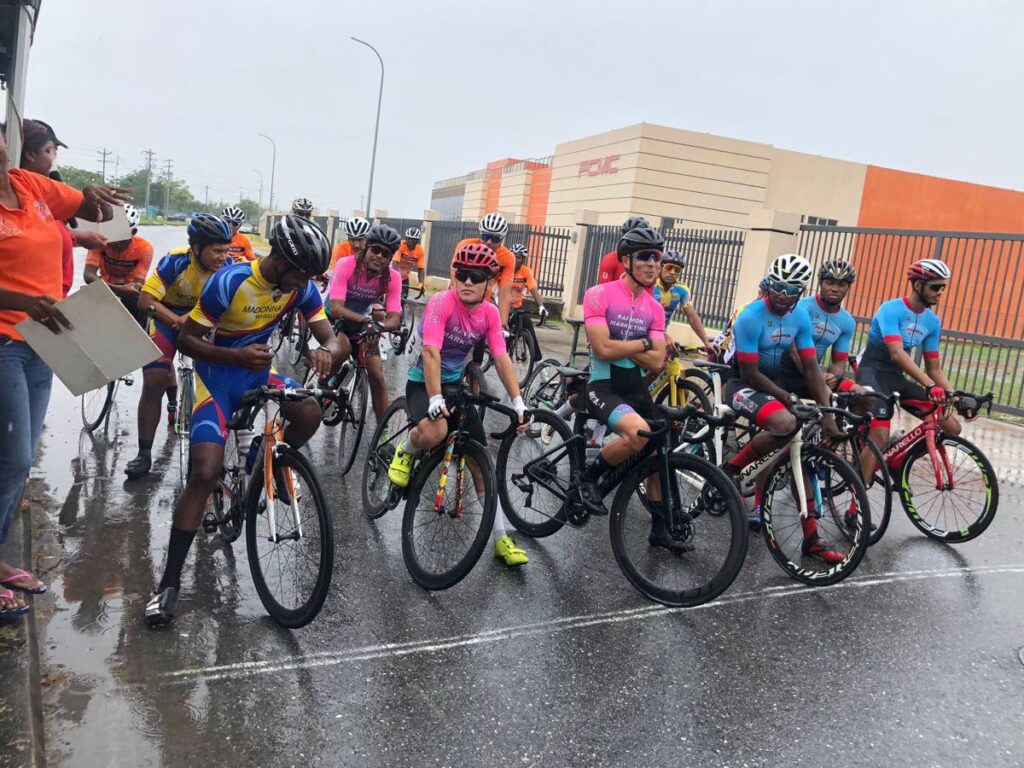Elite male cyclists brave intermittent showers on Sunday ahead of the TT Cycling Federation's road series stage five at Trincity.  - Courtesy TTCF