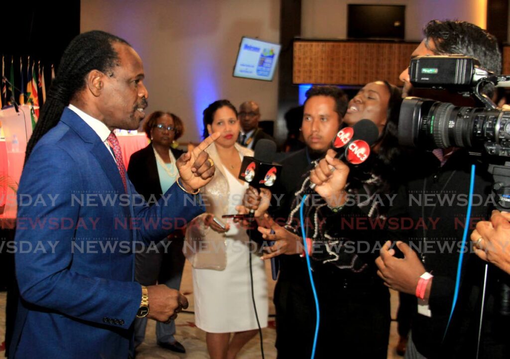 'HELP WE NAH': National Security Minister Fitzgerald Hinds speaks to reporters on Monday at the 37th AGM of the Assn of C'bean Commissioner of Police at the Hyatt Regency, Port of Spain. PHOTO BY AYANNA KINSALE - 