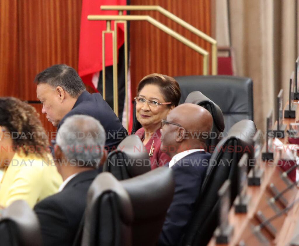 Opposition Leader Kamla Persad-Bissessar with members of her bench in the House on Wednesday. 