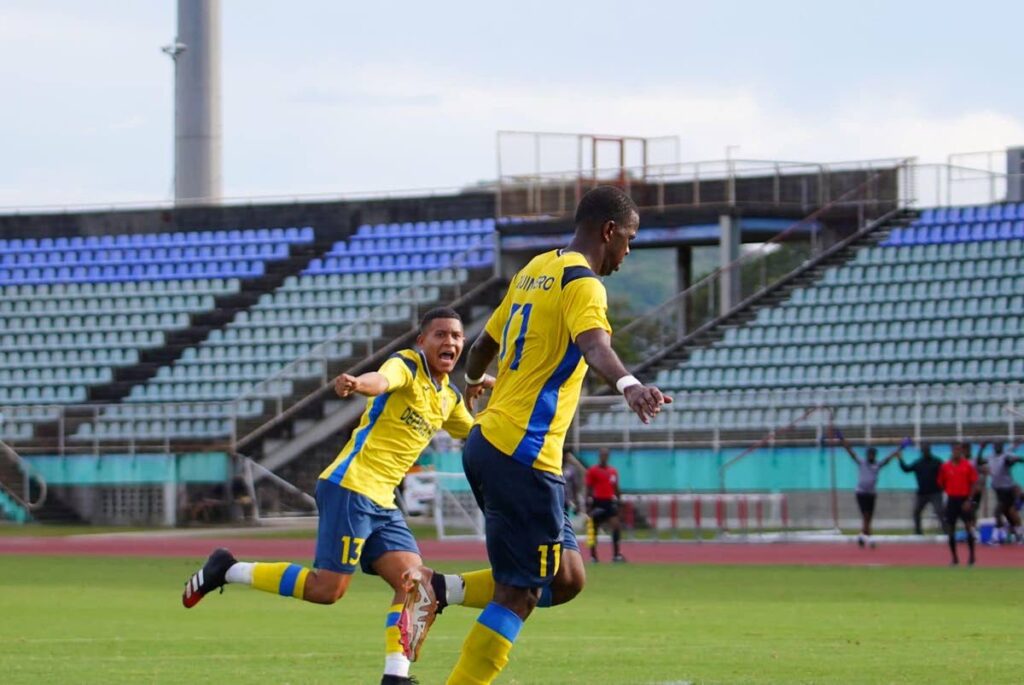 Defence Force FC's Dwight Quintero (R) celebrates after scoring  a goal against Club Sando, on Thursday, during a TT Premier Football League match, on Thursday, at the Manny Ramjohn Stadium, Marabella.  - TT Premier Football League