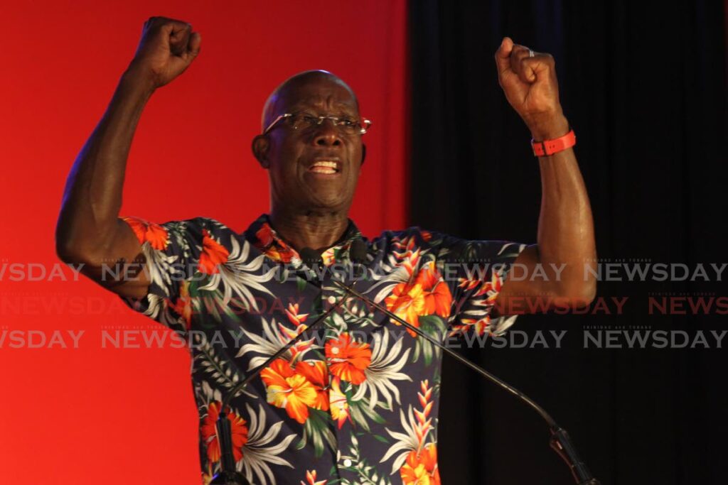 ANGRY PM: Prime Minister Dr Keith Rowley shakes his fists as he waded into the Opposition during a PNM public meeting Thursday night at San Fernando City Hall. PHOTO BY MARVIN HAMILTON - 