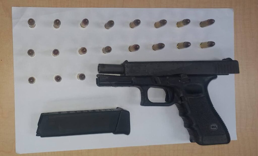 The gun and ammunition which police seized from a Carenage man on Friday. - Photo courtesy TTPS