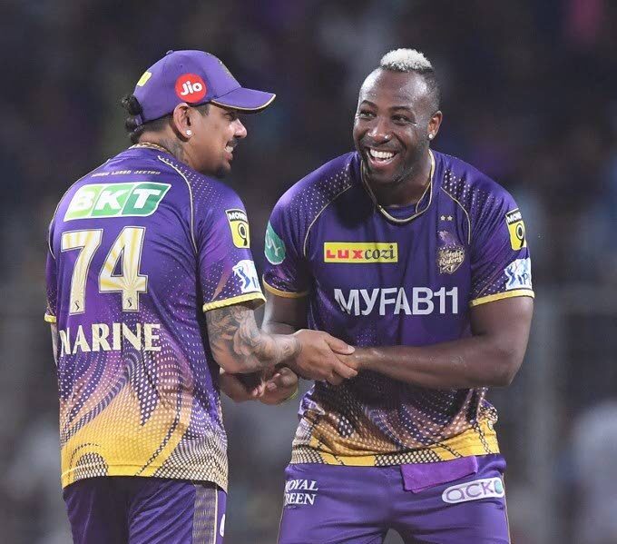Kolkata Knight Riders' Andre Russell (R) celebrates with his teammate Sunil Narine after the dismissal of Rajasthan Royals' Jos Buttler (not pictured) during the Indian Premier League Twenty20 match at the Eden Gardens Stadium in Kolkata on May 11.  - 