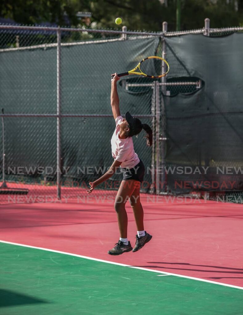 In this November 6, 2021 file photo, Brianna Harricharan serves to Em-Miryam Campbell-Smith during the Girls 14 and Under Lease Operators Junior Tennis Tournament singles match. - Jeff Mayers