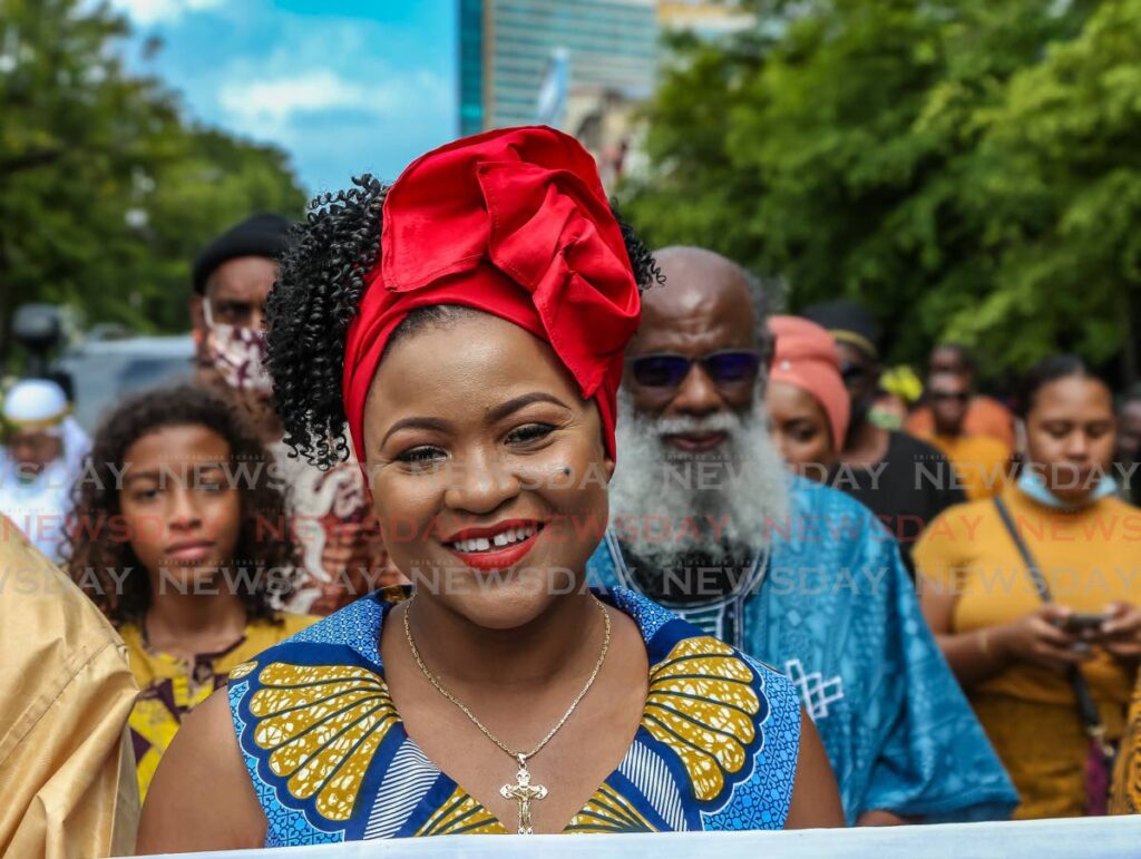 Minister of Education Dr Nyan Gadsby-Dolly participates in an Emancipation Support Committee's Emancipation Day procession. Behind her is Khafra Kambon. - Jeff K. Mayers