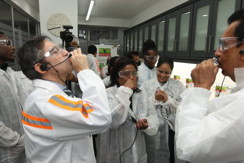 Head of the Nestle Anglo-Dutch Caribbean region, Josue De La Manza, from left, Trade and Industry Minister Paula Gopee-Scoon and Agriculture Minister Kazim Hosein sample Natures Heart almond milk at the launch of a factory line of plant-based products at Nestle's Valsayn facility in September 2022. Trinidad and Tobago has received approval for the suspension of tariffs on almond milk. - Nestle