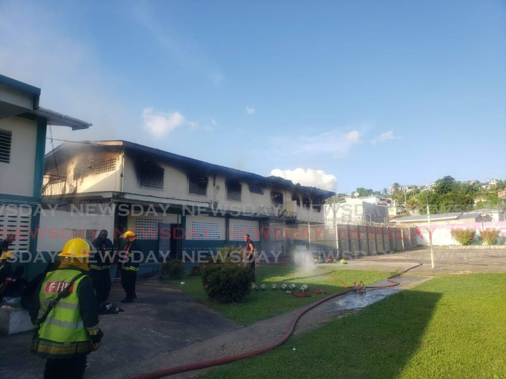 Firefighters attend to a fire at a dormitary at the St Jude's Home for Girls in Belmont, Port of Spain, on April 29.  - 