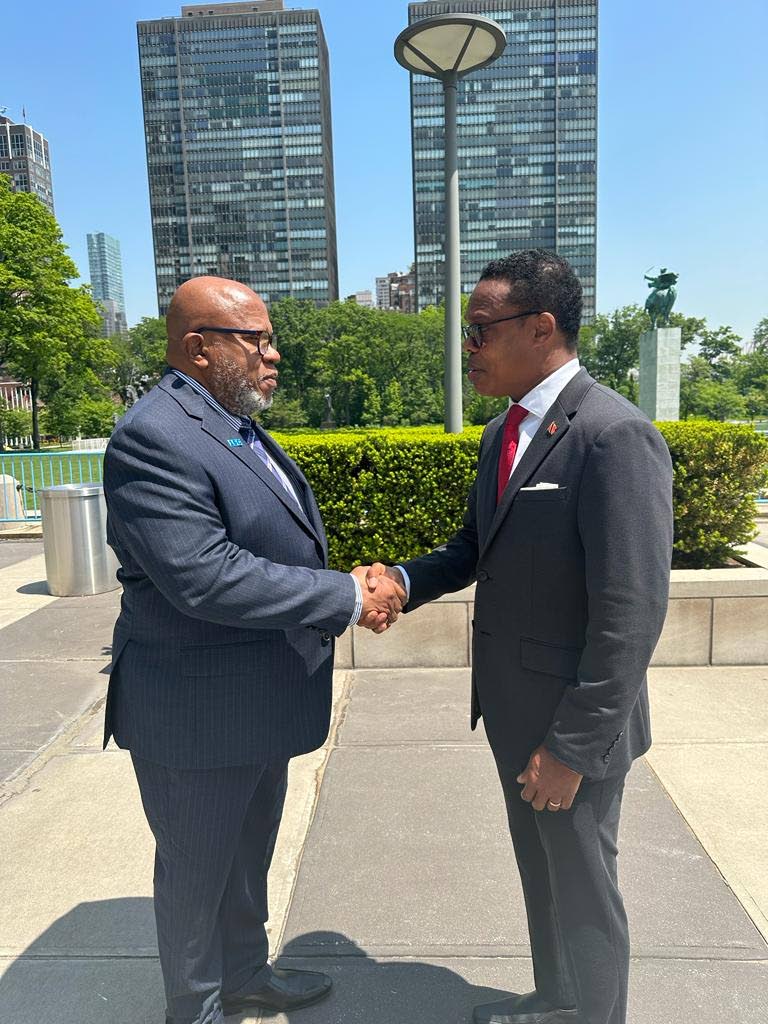 President-elect of the UN General Assembly Dennis Francis (left) is congratulated by Foreign and Caricom Affairs Minister Dr Amery Browne.  - 