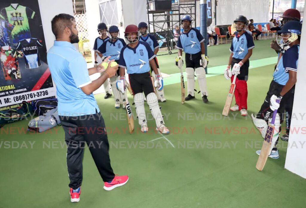 Coach Arvind Balroop (L) speaks with participants of the Nicky P Batting Academy on Saturday, at the Kumar Rampat Cricket Academy, Point Lisas.  - Roger Jacob