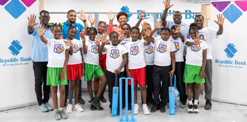 Officials from Republic Bank, the St Lucia National Cricket Asssociation and St Lucia government with youths who will be competing in the Five for Fun cricket programme in St Lucia. - 