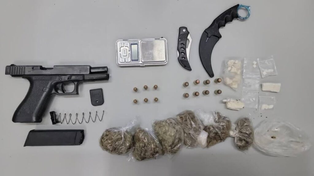 A Glock 22 pistol with ammunition, a quantity of marijuana, cocaine and knives were found by police in a bag on Tuesday. 
The bag was carried by a man who reportedly shot at police in Hoyte Avenue, Arima. Photo courtesy TTPS - 