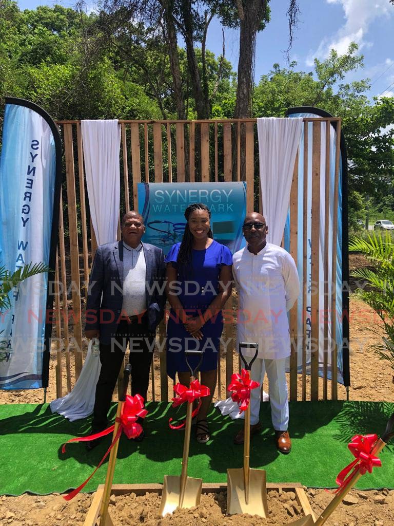 Leslie Henry, from left, director, Sebro Construction Ltd, Cherisse Wallace, director, Land Management Department and THA and Secretary of Infrastructure, Quarries and Urban Development Trevor James at the sod-turning ceremony for the Synergy Water Park at Friendship Estate, Tobago.
 - Corey Connelly