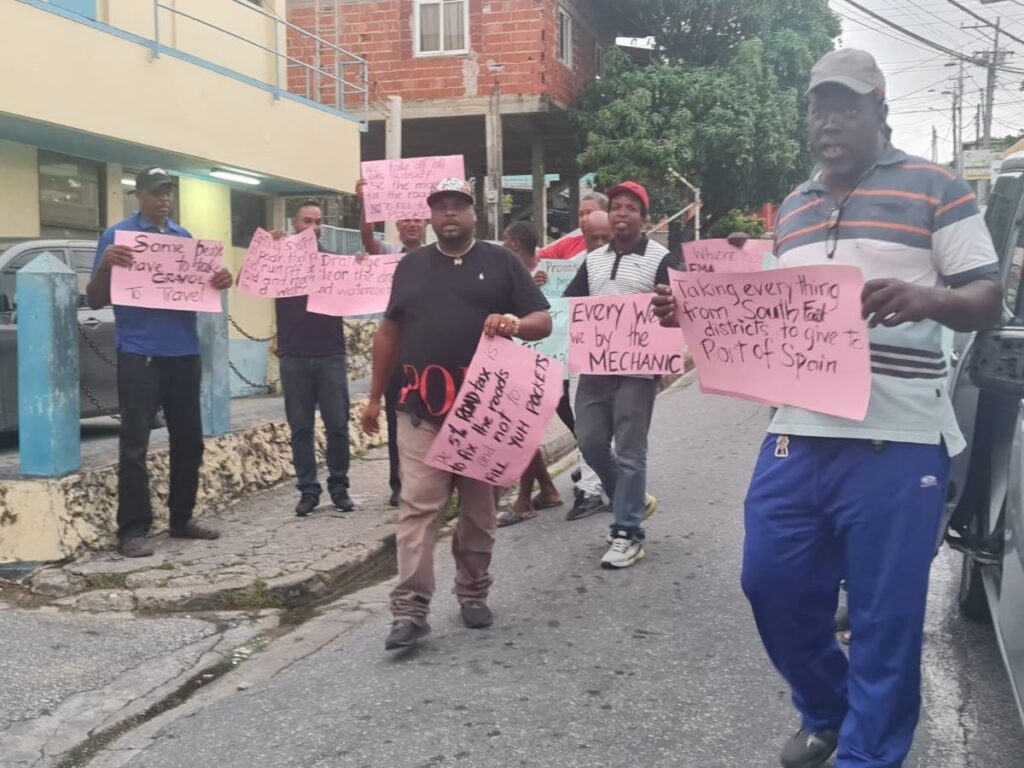 Mayaro/Sangre Grande Taxi Drivers Association members protest over the condition of the Mayaro-Manzanilla Bypass Road at Petersville Junction, Mayaro, on Friday. - 