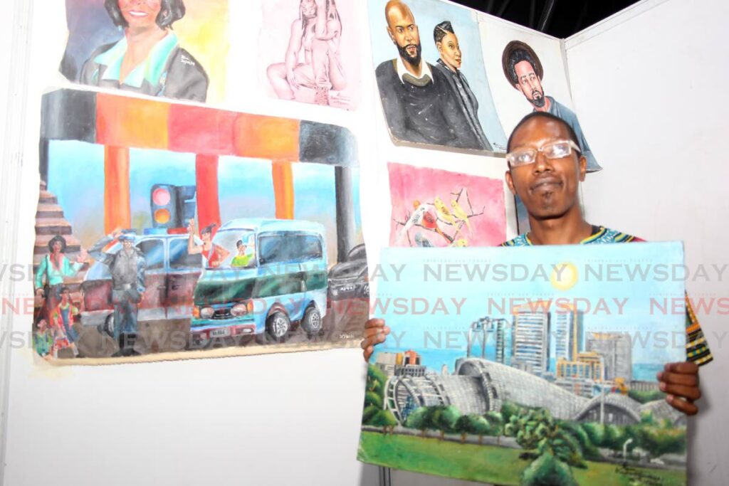 Artist Khaviour Grandison with his display of artistic works at the Best Village Food and Folk fair, Mid Centre Mall, Chaguanas. - Photo by Lincoln Holder