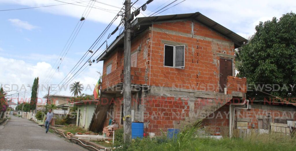 MURDER HOUSE: THe house in St Thomas Street, Tunapuna, where Quincy Gopaul and Isaiah Esom were shot dead on  Saturday night. PHOTO BY ANGELO MARCELLE - 