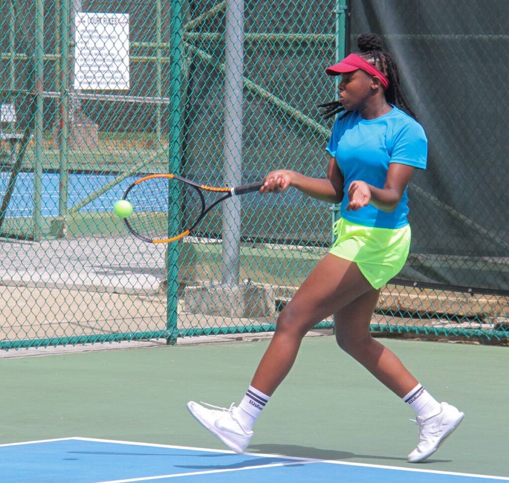Anneleise Orr plays a shot in her match against Karissa Mohammed in the Lease Operators Ltd Girls Under-12 semi-finals, Junior Tennis Tournament, at the National Racquet Centre, Tacarigua on Sunday. PHOTO:ANGELO MARCELLE 11-09-2023 - 