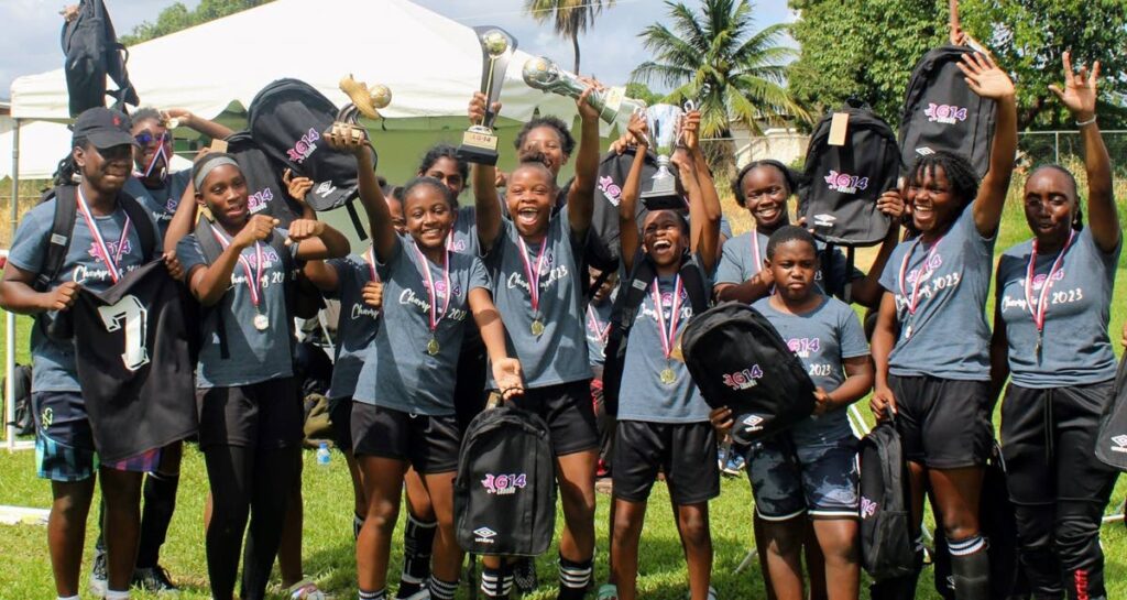 Cox Coaching School players celebrate winning the G-14 League at UWI-Spec, St Augustine in 2023. - File photo