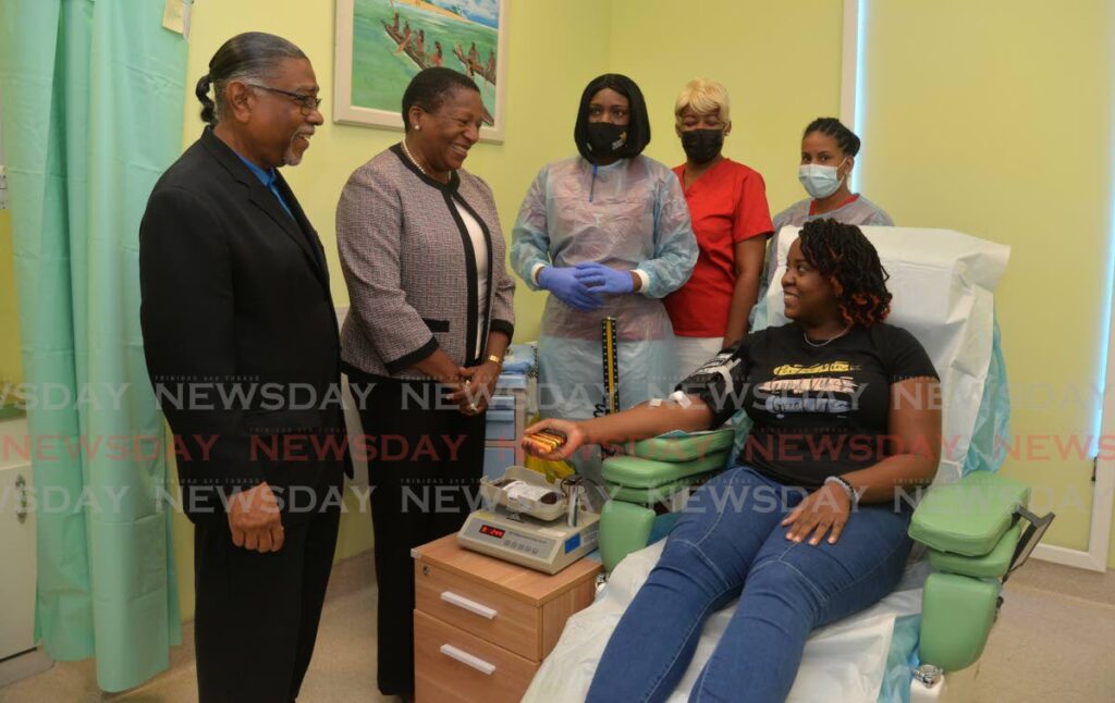 Blood donor, Nicola Alexander, right, speaks with Minister of Planning and Development, Member of Parliament for Arima, Pennelope Beckles, second from left, and from left Mayor of Arima, Cagney Casimire, Registered Nurses, Lois Cook, Candice Allen and Tarneisha Adolphus during the launch of the Blood Donation Lounge at the Arima General Hospital, Arima on Wednesday.  - Anisto Alves