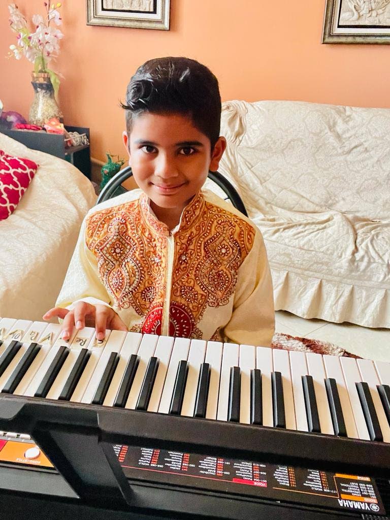 Nirvaan Ramjattan is learning to play the keyboard. - 