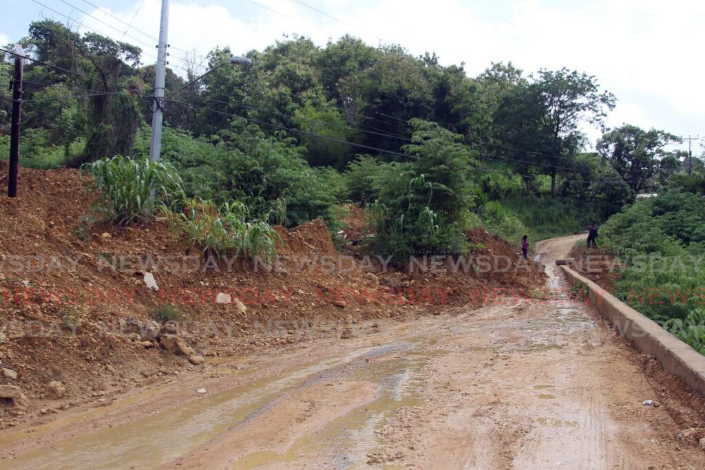 The Guaracara /Tabaquite Main Road remains almost completely blocked by a mudslide on Thursday.  - Lincoln Holder