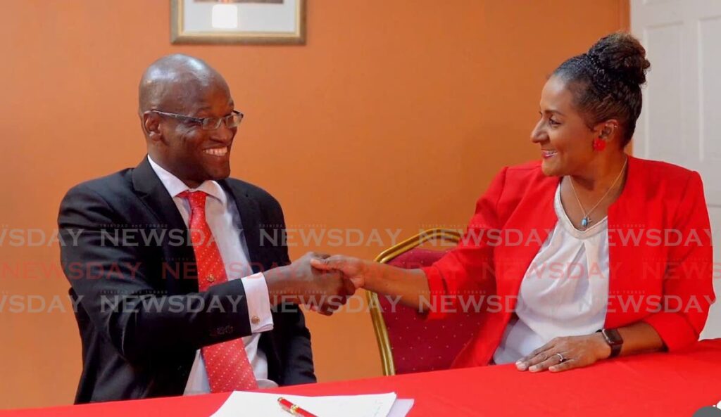 NEW PNMITE: This screen-grab of a video shows former UNC member and chief economist in the office of the Opposition Leader Taharqa Obika, shakes hands with PNM PRO and Government Senator Laurel Lezama-Lee Sing on signing to become a member of the PNM.  - 
