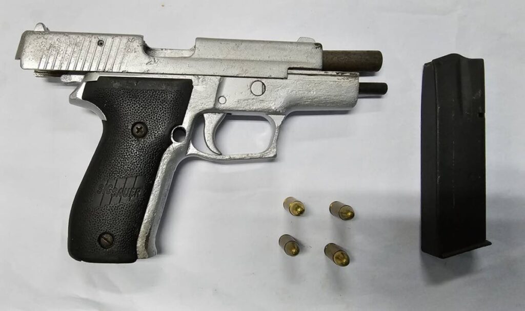 Pistol, magazine and ammunition seized. TTPS PHOTO - 