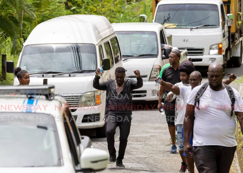 THA assemblyman Watson Duke walks with supporters during his Labour Day March from Kings Bay to the Syd Gray Complex, Roxborough, Tobago on Monday. - David Reid
