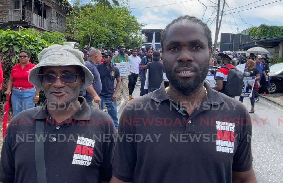 Allan Sampson, left, and Terry Shade at Monday’s Labour Day march in Fyzabad. - YVONNE WEBB