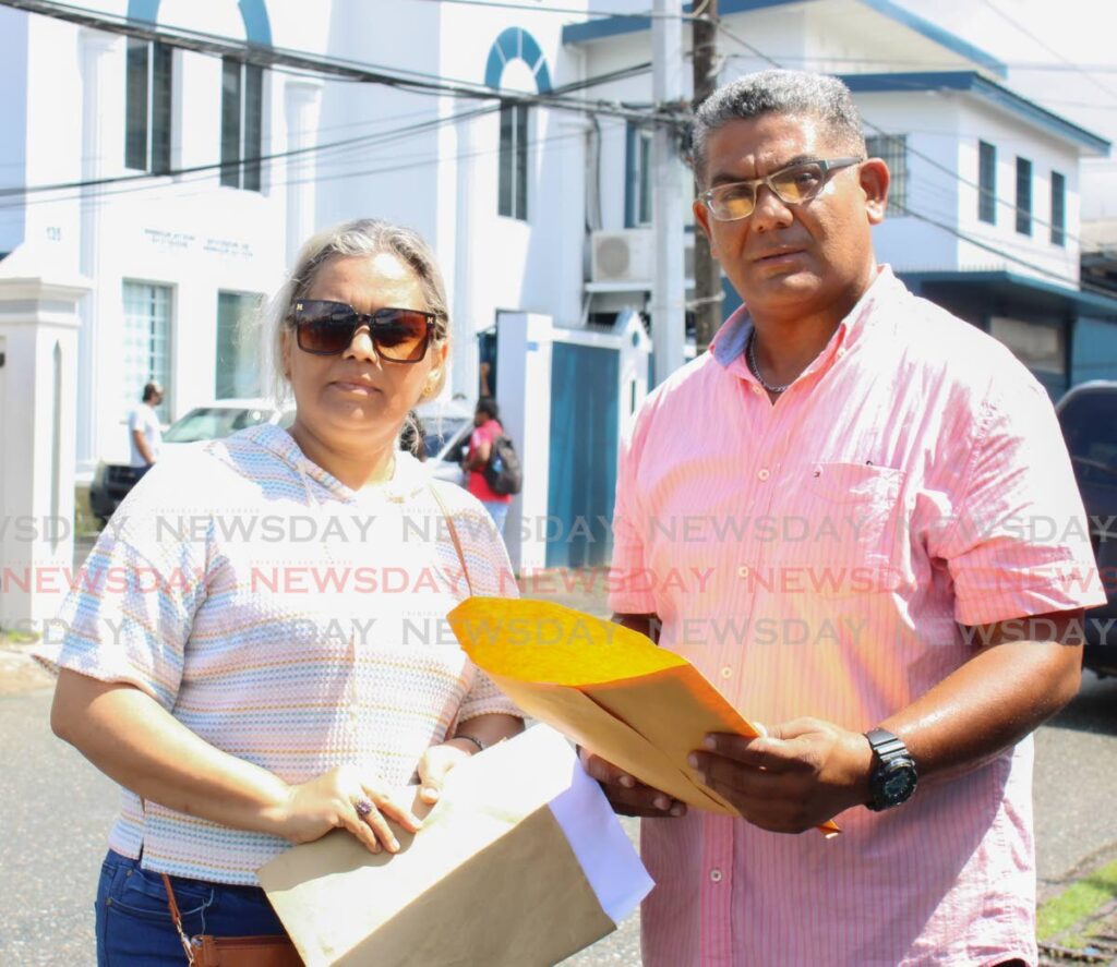 Olennys Palomo and her husband Rosmel Correa arrived early Tuesday in the Immigration office, Henry St.