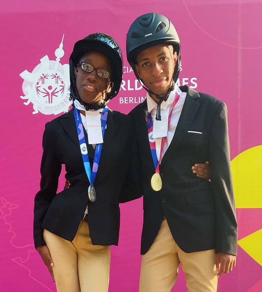 TT's Nathaniel Lewis, right, and Patrice Pennie with their equestrian medals at the Special Olympics World Games in Germany. - 