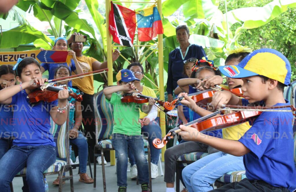 Migrant and local children are learning music at Diego Martin between Wednesdays and Saturdays