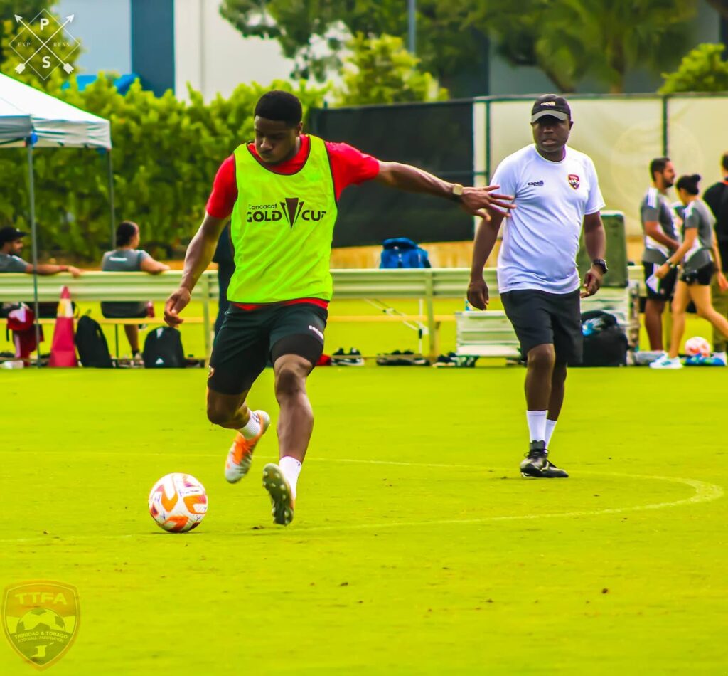 TT senior men's team head coach Angus Eve (R) looks on during a final team training session, on Saturday, at the DRV PNK Stadium in Ft Lauderdale. TT face St Kitts/Nevis on Sunday in their opening Group A match, at the 2023 Concacaf Gold Cup. - TTFA Media