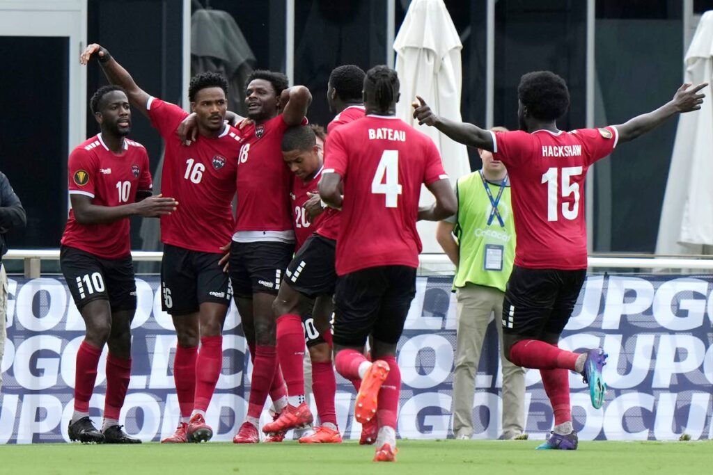 Trinidad and Tobago defender Alvin Jones (16) celebrates after scoring a goal vs St Kitts and Nevis during the first half of a CONCACAF Gold Cup match, Sunday, in Fort Lauderdale, Florida. - AP