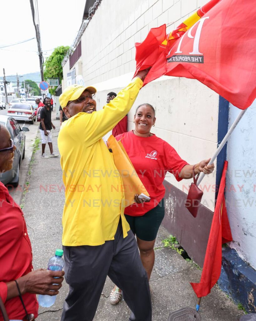 UNC senator Wade Mark speaks to PNM supporters outside the office of the returning officer for the electoral district of Southern Port of Spain on Henry Street, Port of Spain, on Monday. - Jeff K. Mayers
