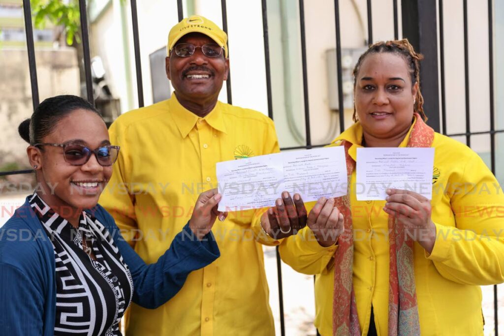 UNC Senator Wade Mark with candidates for Belmont North and West Chantal Subero and for Belmont East Leanna Babb-Gonzalez Henry Street, Port of Spain on June 26 nomination day. - Photo by Jeff K. Mayers