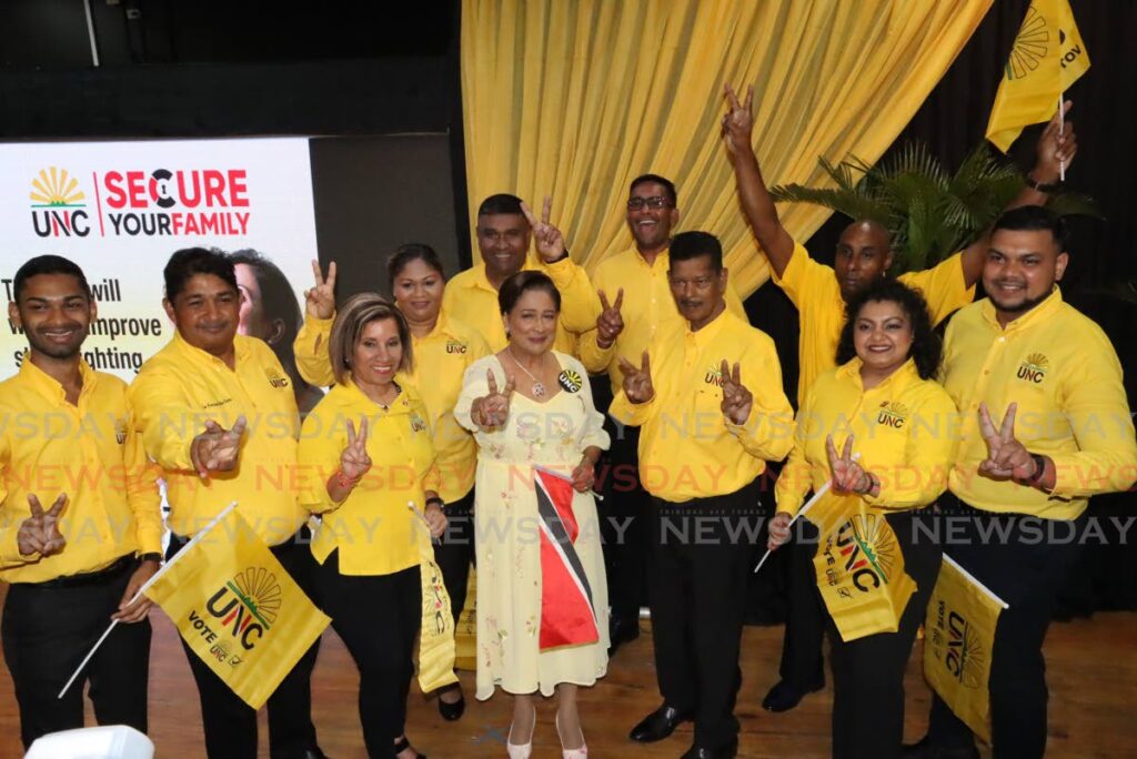 UNC Political Leader Kamla Persad-Bissessar, centre, with some of her party's local government candidates at Naparima College, San Fernando. - Roger Jacob 