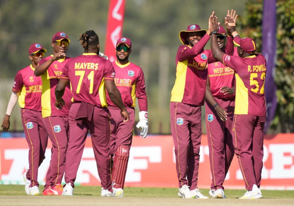 West Indies players celebrate a wicket during their ICC Men's Cricket World Cup Qualifier against the United States at Takashinga Sports Club in Harare, Zimbabwe, last Sunday. - AP