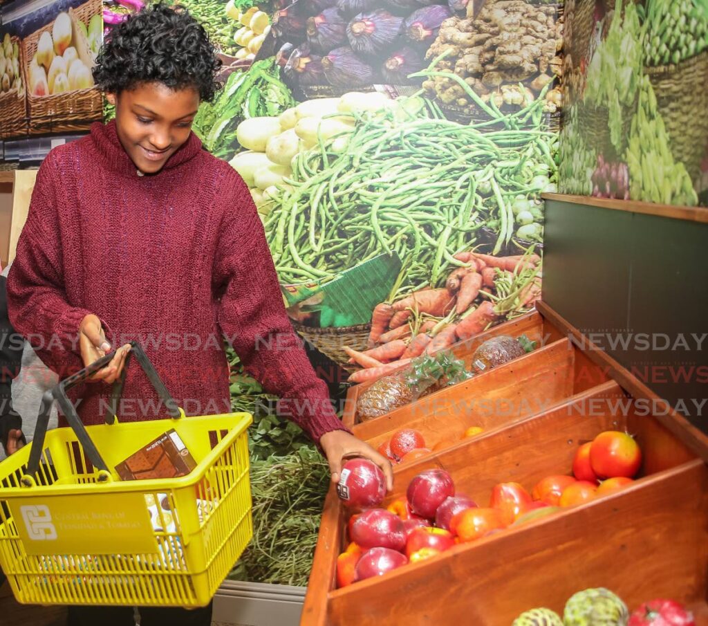 Brianna Blanc shops for vegetables at a mini mart meant to teach people about the value of money at the Central Bank museum, Port of Spain in February 2019 - File photo/Jeff Mayers