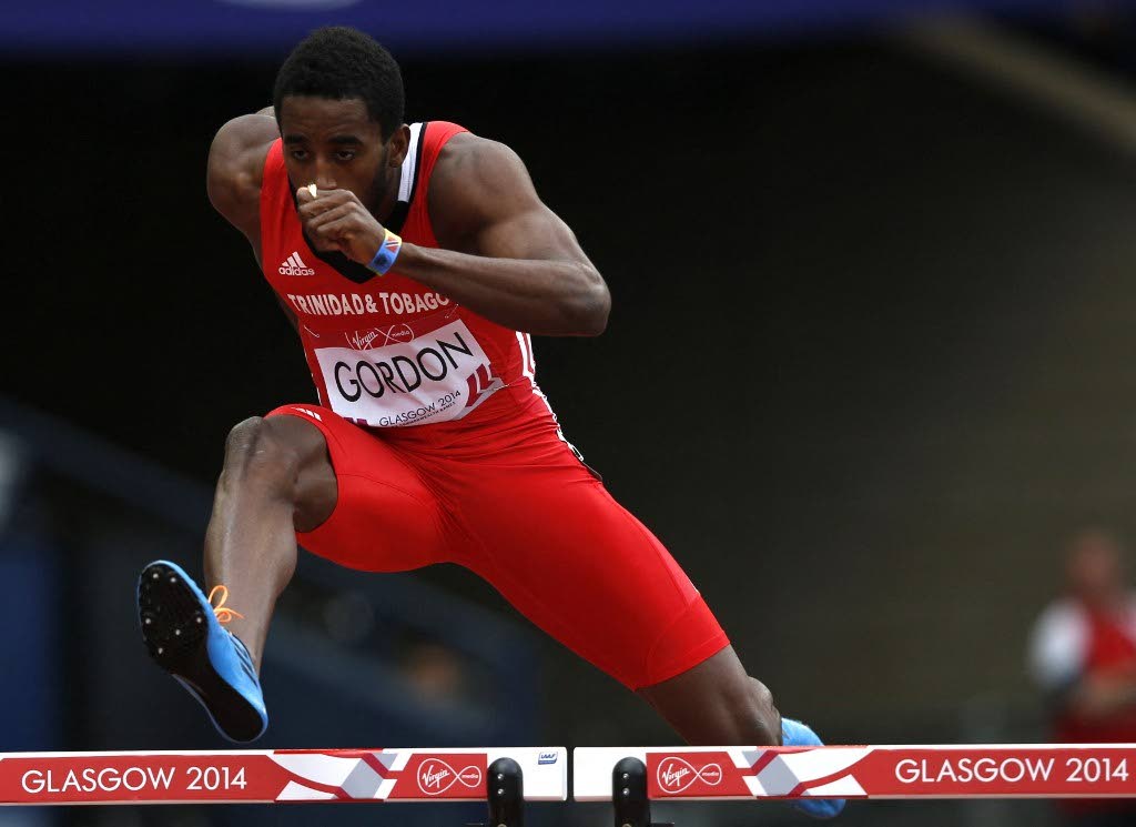 In this July 30 2014 file photo, TT's  Jehue Gordon  competes in the heats of the men's 400m hurdles athletics event at Hampden Park during the 2014 Commonwealth Games in Glasgow, Scotland. - 